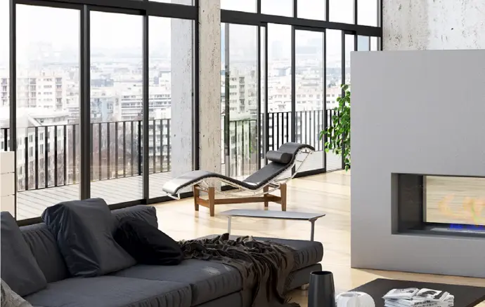 Modern Appartement met openhaard Schrijnpoort BV Ruim modern appartement loft met openhaard uitzicht op andere apartementen en een zwarte zetel die niet opgeruimt is in de linker voorhoek van de foto Schrijnpoort BV